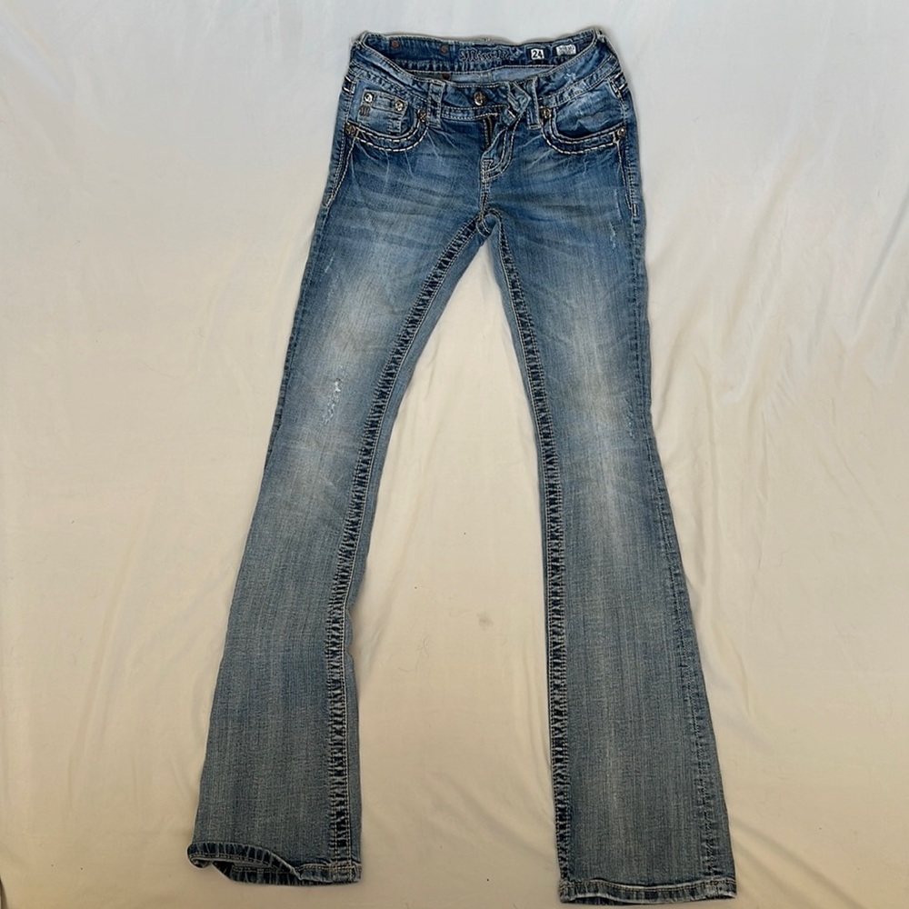 Miss Me low waisted size 24 boot cut blue jeans.